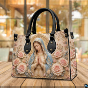 Alternative presentation of praying Virgin Mary handbag with floral baroque details