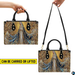 Top perspective displaying spacious interior compartments and lining of the Marian handbag.