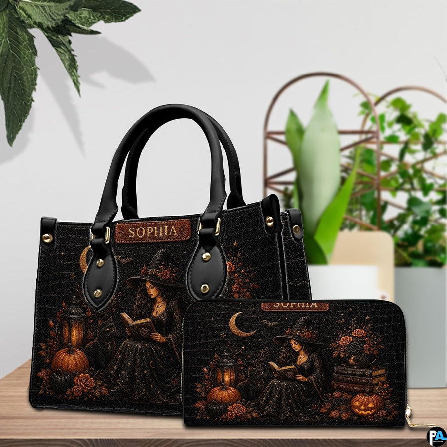 Witchy halloween art accessory and companion item arranged together on wooden tabletop near potted greenery.