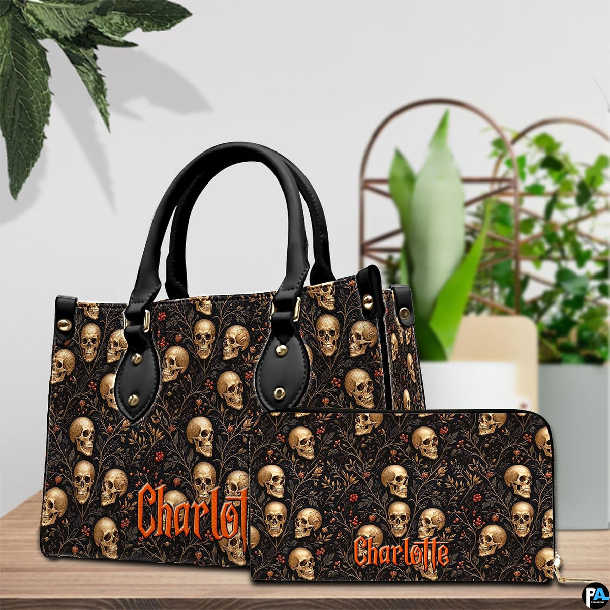Angled tabletop view showcasing the coordinated botanical skull and red berry artwork across two accessory items.
