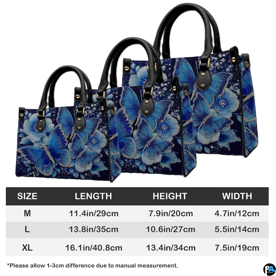 Coordinated arrangement of sapphire butterfly handbag and wallet displaying unified floral design.