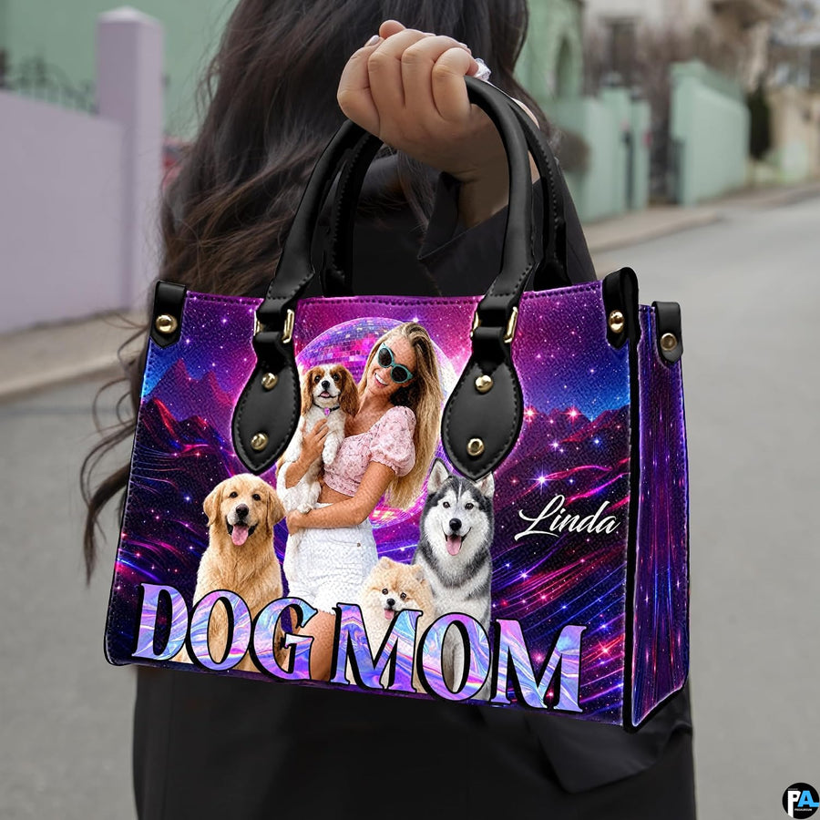 Front view of canine handbag featuring cheerful dogs, glowing disco sphere, and neon mountain landscape.