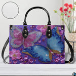 Side perspective of purple crystal butterfly handbag showing structured shape
