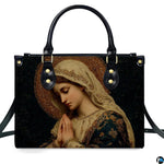 Direct front perspective of handbag showcasing Byzantine micro-mosaic portrait of praying Mary