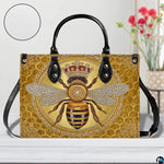 Opposite profile view of the honey bee handbag with black straps and trim.