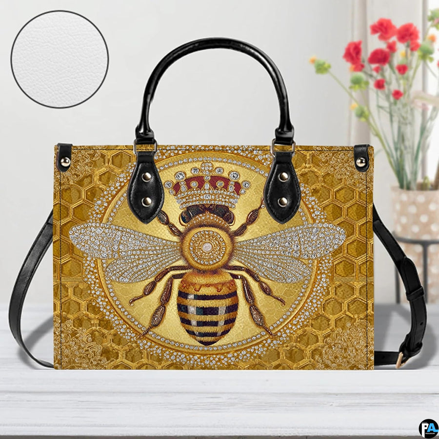 Opposite profile view of the honey bee handbag with black straps and trim.