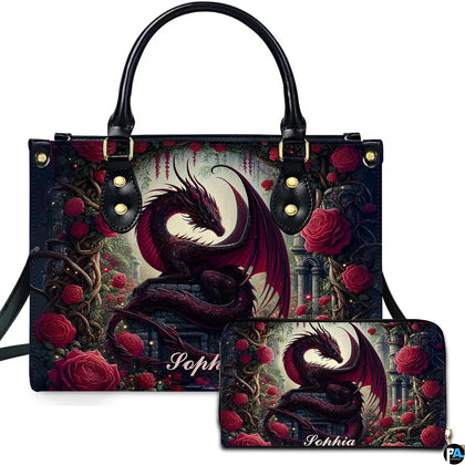 Studio front view of handbag and matching wallet with crimson dragon and red rose garden artwork.