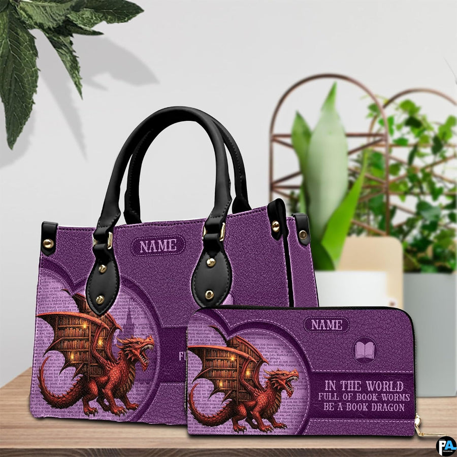 Fantasy book dragon violet handbag and matching wallet set displayed on wooden table.