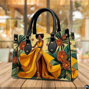 Tropical golden gown art piece positioned upright on a natural wooden tabletop in a café.