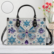 Open interior view of matching butterfly wallet displaying card slots and zipper pocket.