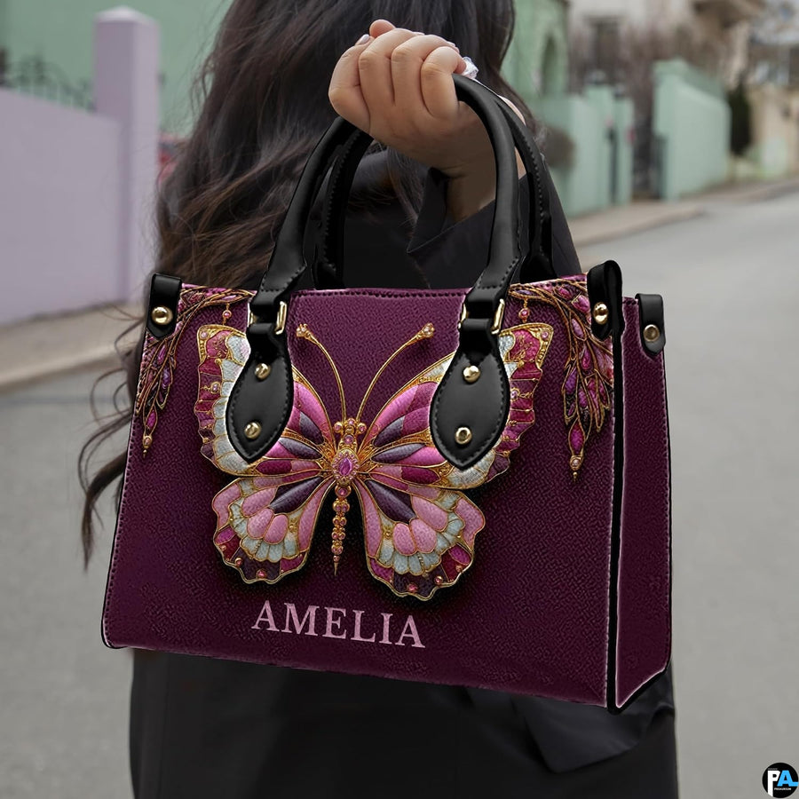 Angled view of matching jeweled butterfly set showcasing ornate metallic golden filigree details