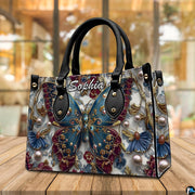 Alternative angle display of baroque teal butterfly handbag and wallet
