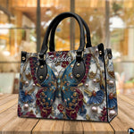 Alternative angle display of baroque teal butterfly handbag and wallet