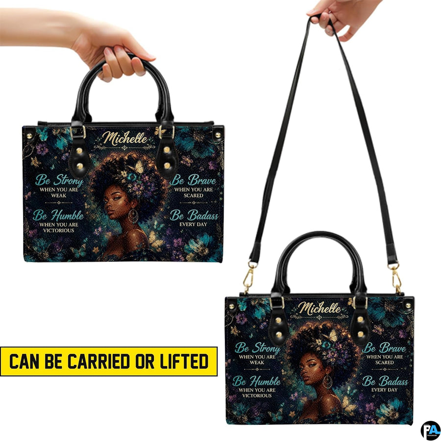 Two carrying views of teal butterfly portrait handbag