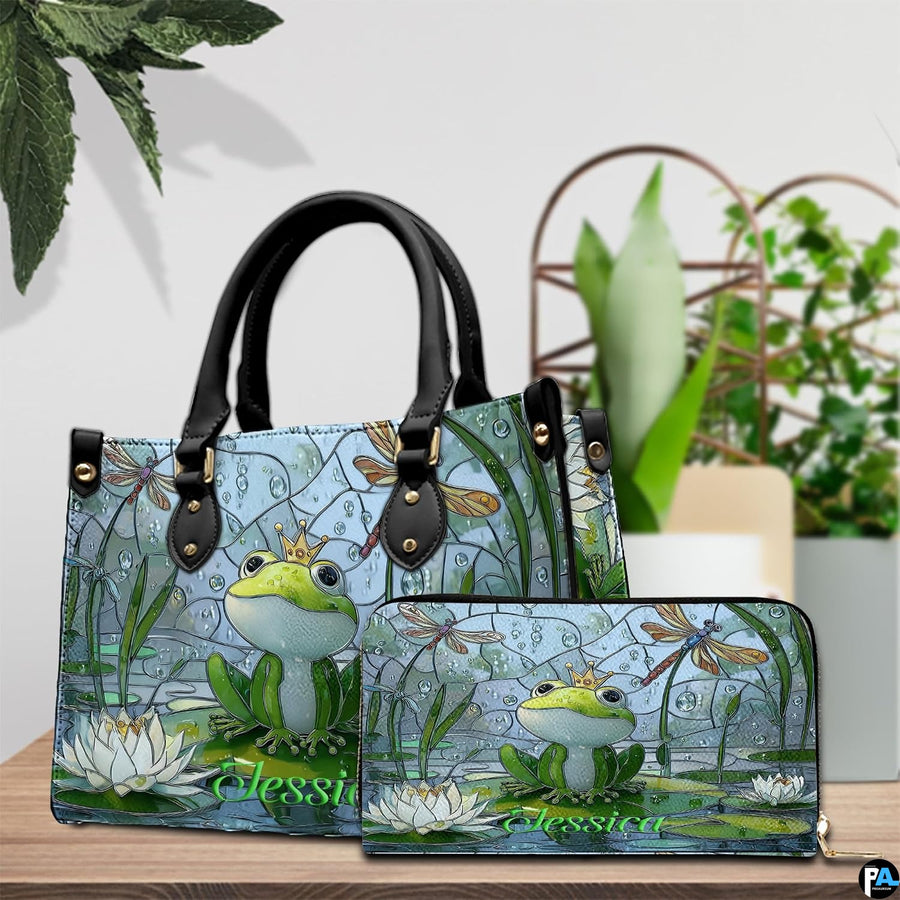 Side profile view showing structured silhouette and black carrying handles of the handbag.