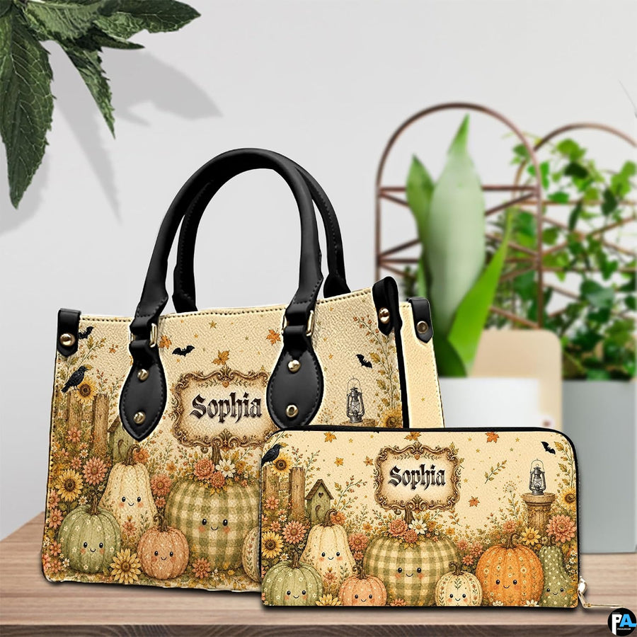 Pair showcase featuring smiling pumpkin artwork placed on wooden tabletop beside leafy potted plant.