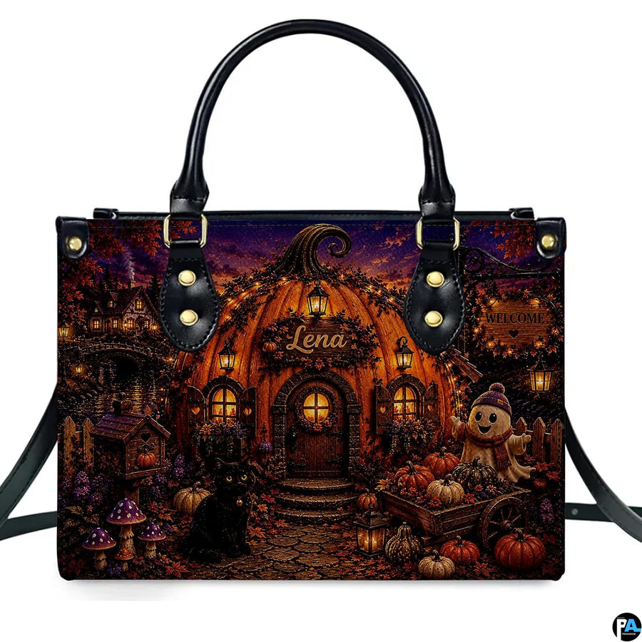 Centered frontal view presenting the pumpkin house art illustration on the primary accessory silhouette.