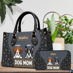 Angled display of puppy themed handbag shown with coordinating zippered companion wallet.