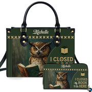 Front view of green book cover handbag and matching wallet featuring reading owl illustration.