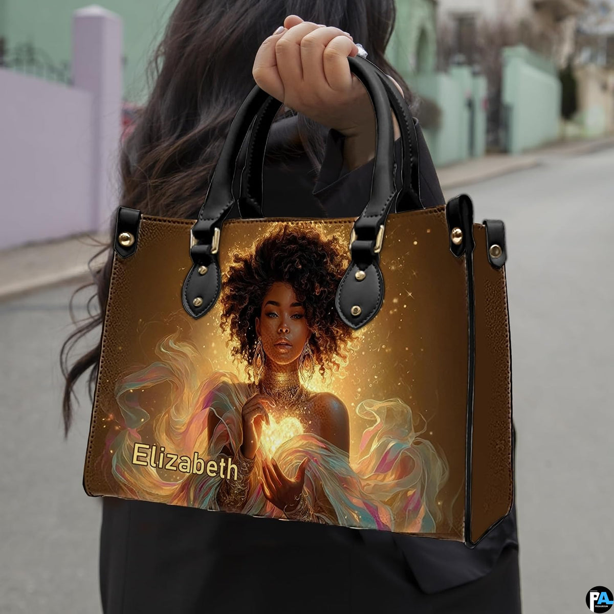Handbag carried by person outdoors demonstrating top handle style