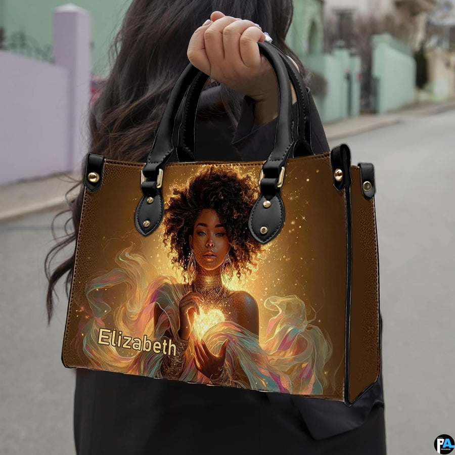 Handbag carried by person outdoors demonstrating top handle style