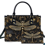 Studio display of gothic steampunk dragonfly handbag and matching wallet with antiqued gold filigree on black