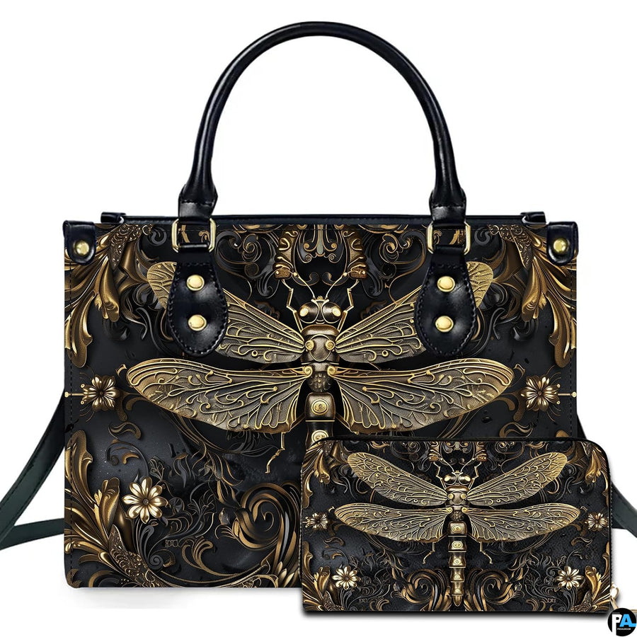 Studio display of gothic steampunk dragonfly handbag and matching wallet with antiqued gold filigree on black
