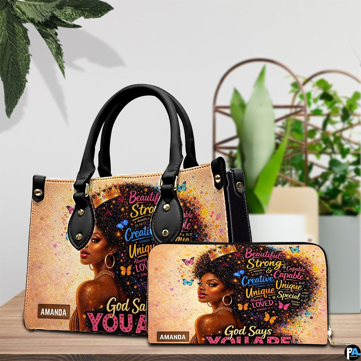 Crowned Black woman portrait handbag and wallet arranged on a table