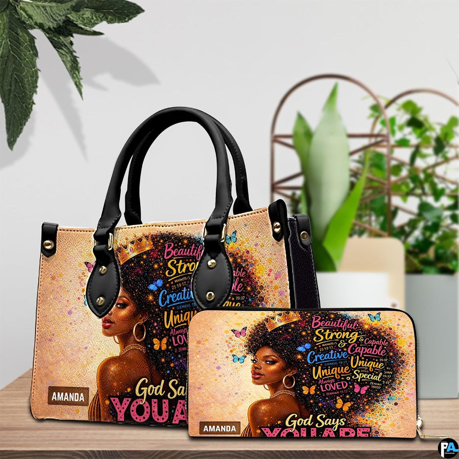 Crowned Black woman portrait handbag and wallet arranged on a table