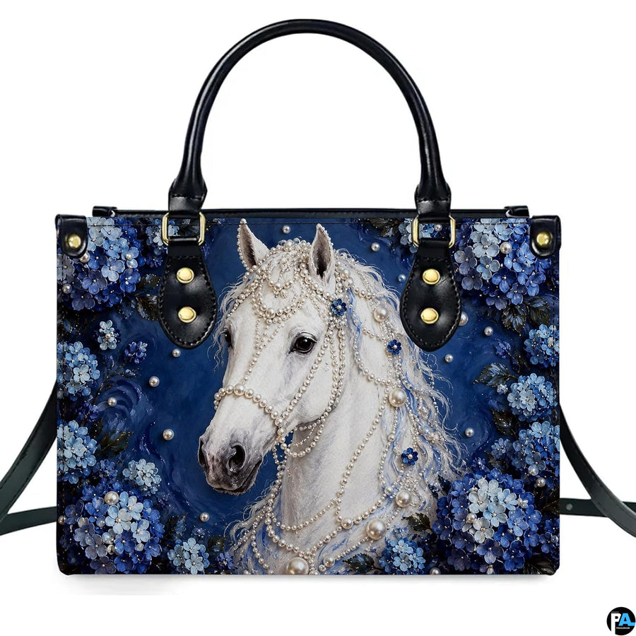 White horse pearl art showing equine portrait adorned by beads and blue hydrangeas on navy surface.