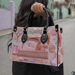 Model showcasing rose gold sewing machine design outdoors along a quiet street.