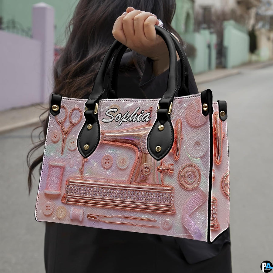 Model showcasing rose gold sewing machine design outdoors along a quiet street.