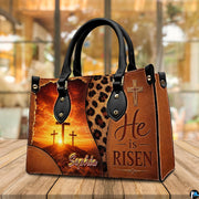 Calvary sunrise and leopard print handbag resting on a wooden cafe tabletop.