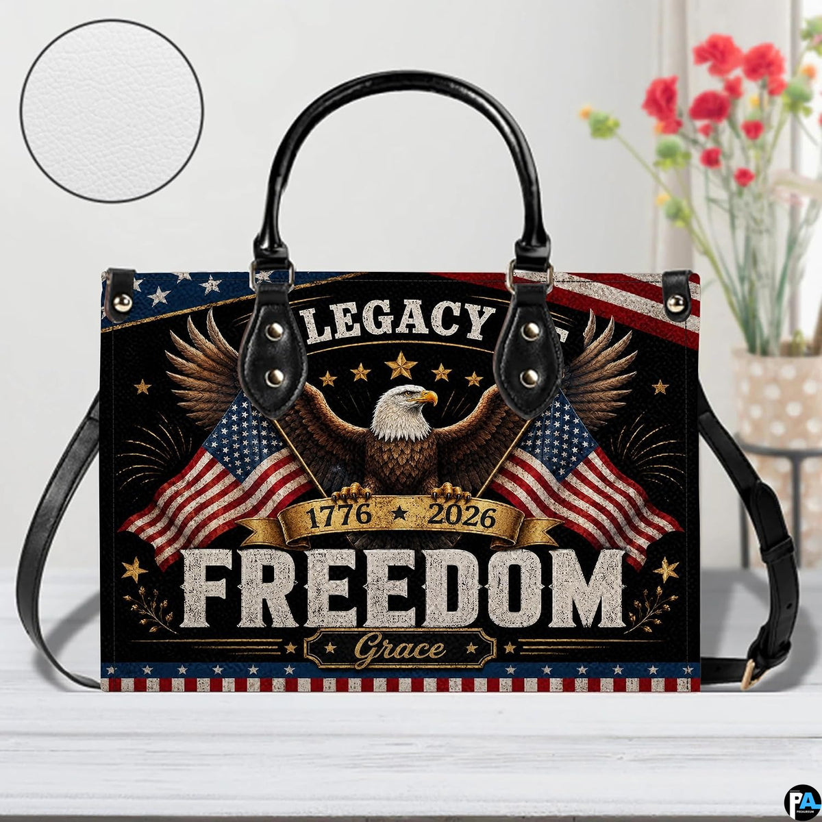 Close-up front view of handbag showing bald eagle, dual waving flags, and stars