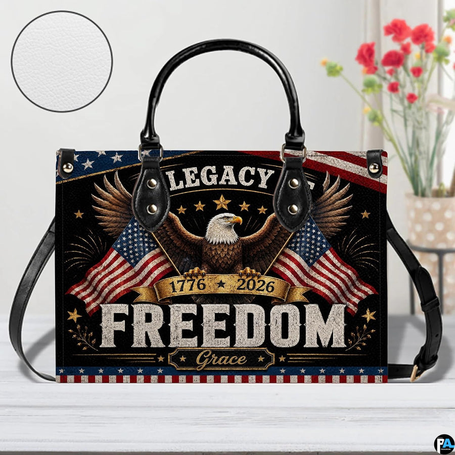 Close-up front view of handbag showing bald eagle, dual waving flags, and stars