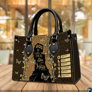 Silhouette faith handbag displayed on a tabletop in a bright interior environment.