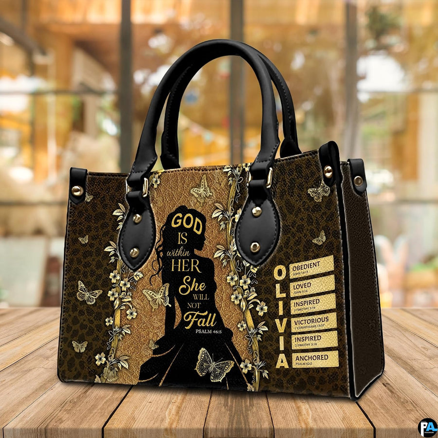 Silhouette faith handbag displayed on a tabletop in a bright interior environment.