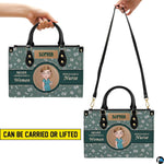 Side profile view of handbag showcasing continuous sage green medical pattern