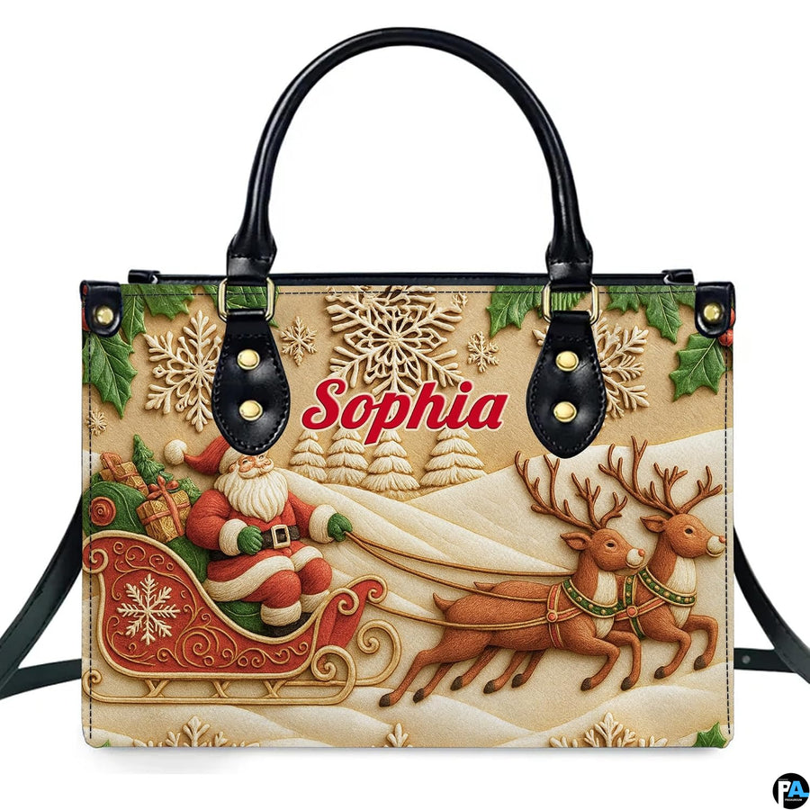 Front view of holiday handbag featuring carved bas-relief artwork of Santa in sleigh with reindeer