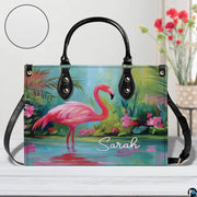 Street perspective of the colorful botanical flamingo shoulder bag.