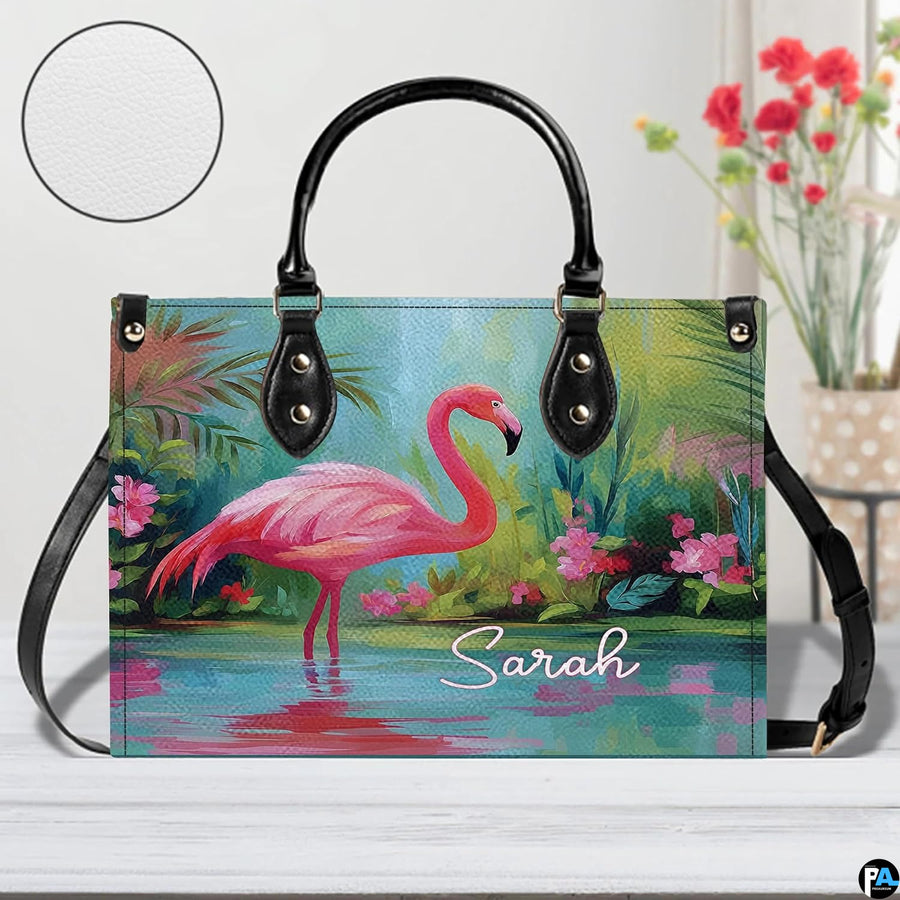 Street perspective of the colorful botanical flamingo shoulder bag.