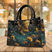 Angled perspective view of celestial dragonfly handbag resting on a rustic wooden tabletop near a window