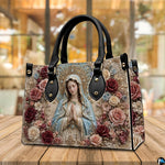 Baroque crowned Virgin Mary handbag resting on wooden table in sunlit indoor space