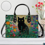 Straight-on studio view of black cat garden art highlighting detailed floral surface texture.