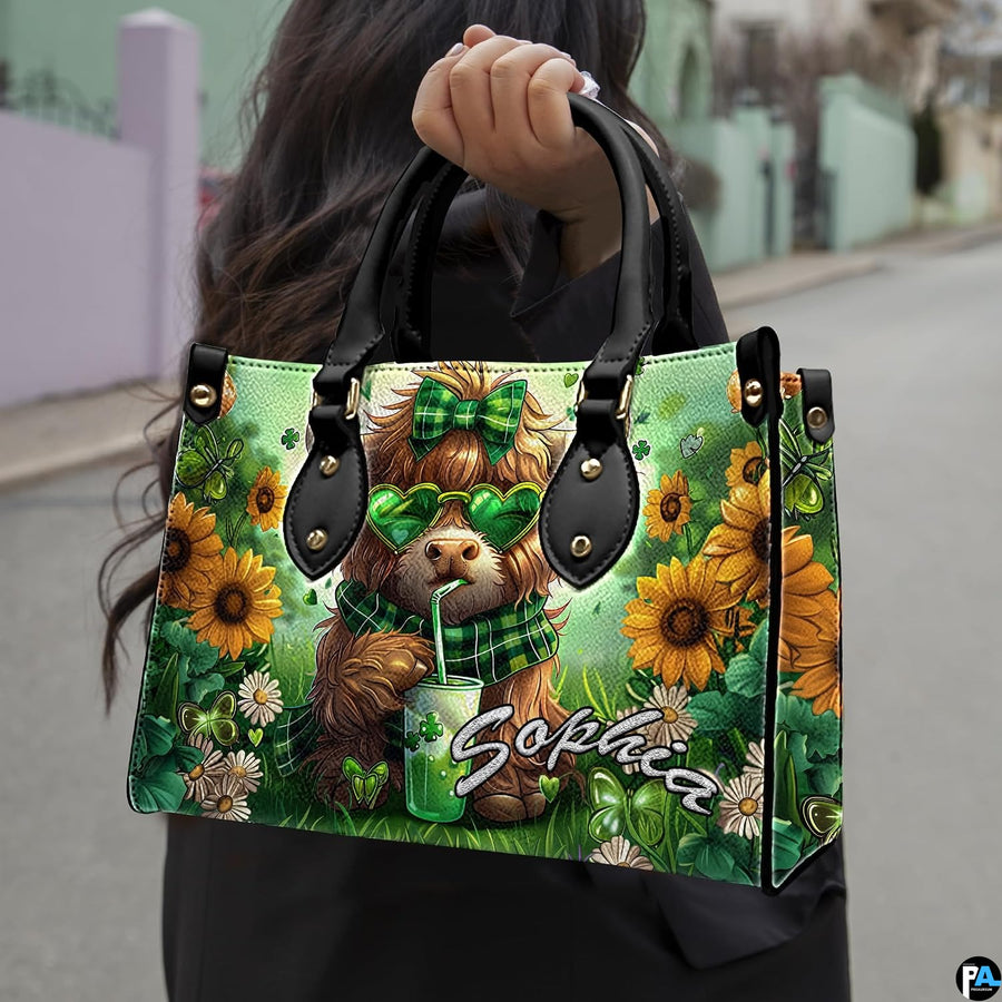 Outdoor street view of festive green Highland cow artwork with sunflowers carried by hand