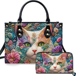 Studio presentation showing white cat filigree artwork alongside matching companion accessory on plain white surface.