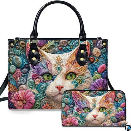Studio presentation showing white cat filigree artwork alongside matching companion accessory on plain white surface.