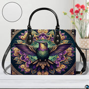 Handbag displayed in indoor setting with floral arrangement and circular texture close-up inset.