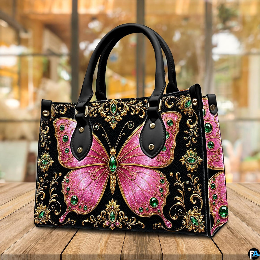 Atmospheric view of pink jeweled butterfly artwork resting on wooden surface in ambient café setting.