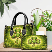 Green clover handbag and matching wallet in a tabletop scene